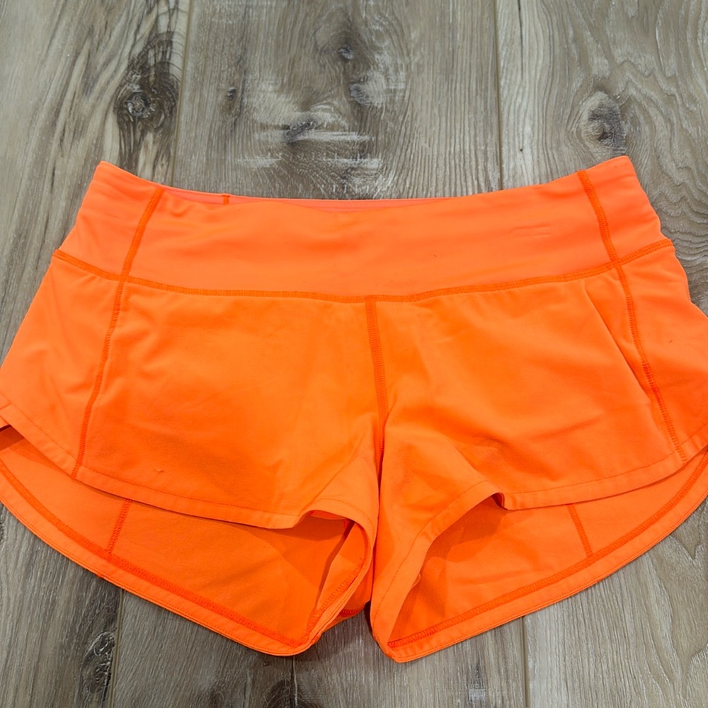 Lululemon speed up low rise 2.5 shorts size 4 neon orange